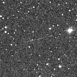 <b>January 26, 1955</b><br>Prediscovery image of asteroid 1999 AN10 taken from the Palomar Digital
Sky Survey.  The faint streak is the trail left by the asteroid.  The
image has been contrast-enhanced.